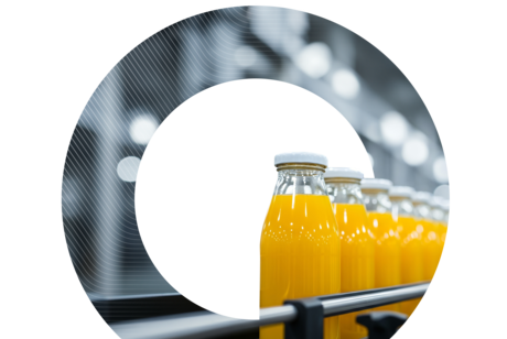 Glass bottles filled with bright orange juice move along an automated conveyor belt in a factory, viewed through a stylized circular cutout.