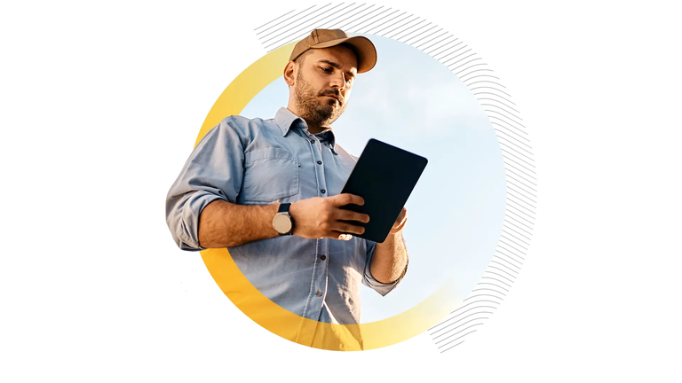 A logistics worker using a digital tablet outdoors to manage workflows, symbolizing the digitalization of transport operations and real-time connectivity.