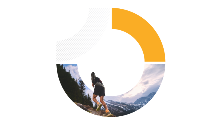 A trail runner with a backpack is climbing a rocky, wooded mountain path