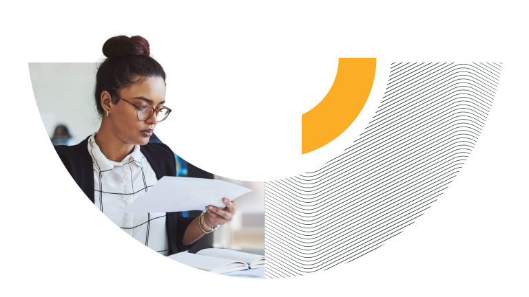 Woman looking at a paper document in a Trimble circle