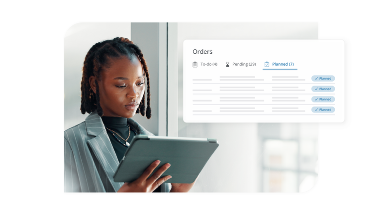 Businesswoman reviewing order confirmations on a tablet in an office setting