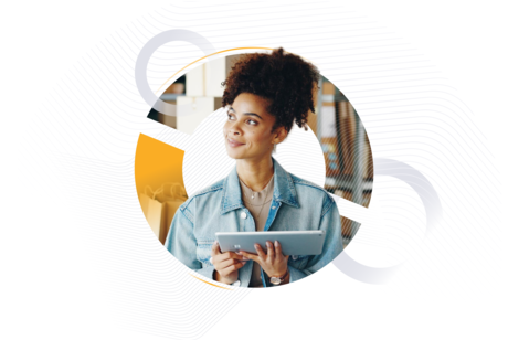 A woman in a denim jacket holding a tablet and smiling thoughtfully in a warehouse or fulfillment center, framed by abstract geometric graphics. Context-driven version: A logistics professional using a digital tablet to manage freight or inventory in a warehouse setting, illustrating AI-supported logistics technology.