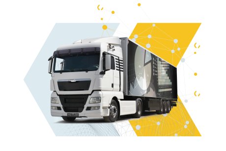 White truck with analytics graphics on a geometric background.