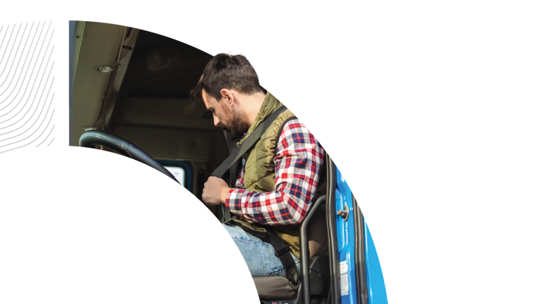 A man in a red checkered shirt and olive vest fastens his seatbelt inside a blue truck cab, presented within a curved graphic frame on a light gray background.