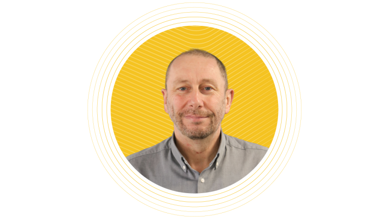 A professional headshot of Gary Owen, Head of Logistics at Portakabin, smiling against a bright yellow circular background.